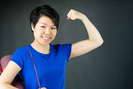 attractive woman on plein background shot in studio with soft lights with an interesting expression and dramatic lightingの写真素材