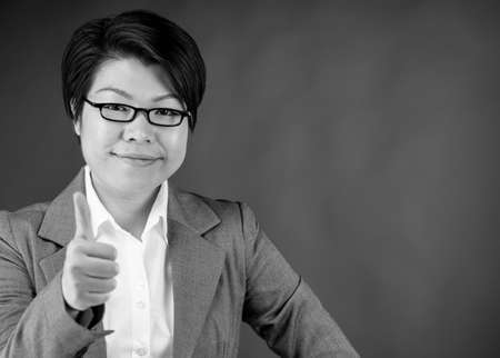 attractive woman on plein background shot in studio with soft lights with an interesting expression and dramatic lighting Black And White, b&wの写真素材