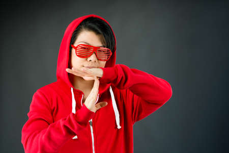 attractive woman on plein background shot in studio with soft lights with an interesting expression and dramatic lightingの写真素材