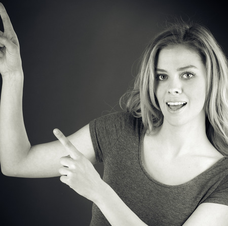 attractive woman on plein background shot in studio with soft lights with an interesting expression and dramatic lighting Black And White, b&wの写真素材
