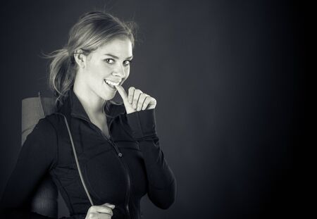 attractive woman on plein background shot in studio with soft lights with an interesting expression and dramatic lighting Black And White, b&wの写真素材
