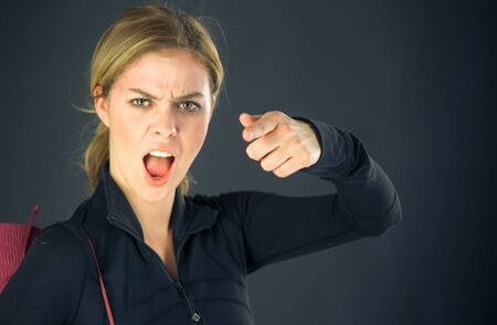 attractive woman on plein background shot in studio with soft lights with an interesting expression and dramatic lightingの写真素材