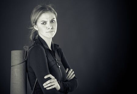 attractive woman on plein background shot in studio with soft lights with an interesting expression and dramatic lighting Black And White, b&wの写真素材