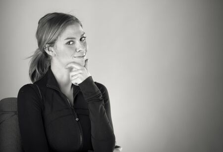 attractive woman on plein background shot in studio with soft lights with an interesting expression and dramatic lighting Black And White, b&wの写真素材