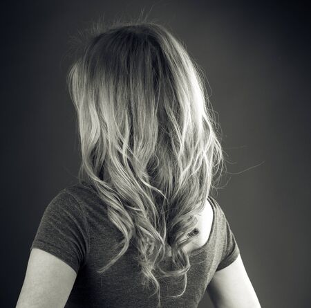attractive woman on plein background shot in studio with soft lights with an interesting expression and dramatic lighting Black And White, b&wの写真素材