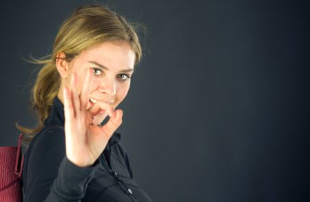 attractive woman on plein background shot in studio with soft lights with an interesting expression and dramatic lightingの写真素材