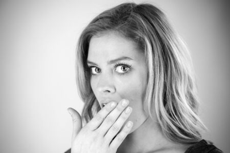 attractive woman on plein background shot in studio with soft lights with an interesting expression and dramatic lighting Black And White, b&wの写真素材
