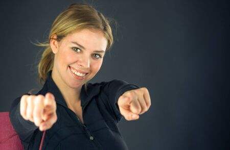 attractive woman on plein background shot in studio with soft lights with an interesting expression and dramatic lightingの写真素材
