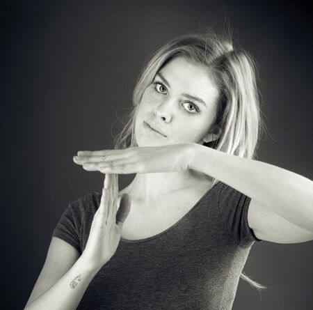 attractive woman on plein background shot in studio with soft lights with an interesting expression and dramatic lighting Black And White, b&wの写真素材