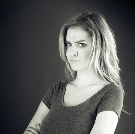 attractive woman on plein background shot in studio with soft lights with an interesting expression and dramatic lighting Black And White, b&wの写真素材