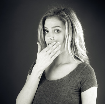 attractive woman on plein background shot in studio with soft lights with an interesting expression and dramatic lighting Black And White, b&wの写真素材