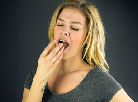 attractive woman on plein background shot in studio with soft lights with an interesting expression...