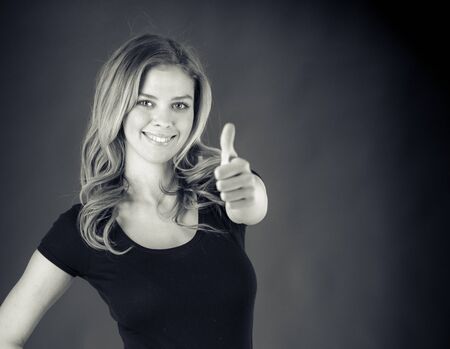 attractive woman on plein background shot in studio with soft lights with an interesting expression and dramatic lighting Black And White, b&wの写真素材