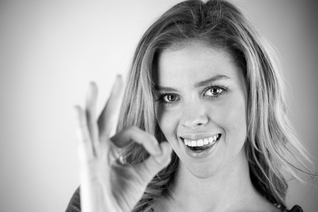 attractive woman on plein background shot in studio with soft lights with an interesting expression and dramatic lighting Black And White, b&wの写真素材