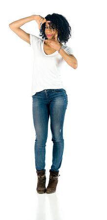 attractive woman on plein background shot in studio with soft lights with an interesting expression and dramatic lightingの写真素材