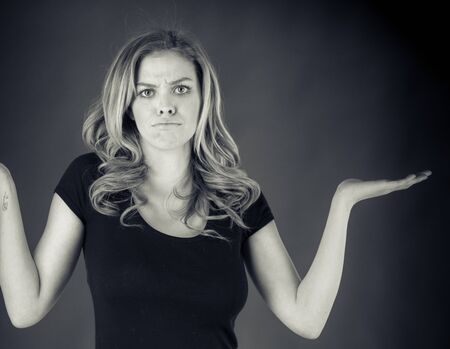 attractive woman on plein background shot in studio with soft lights with an interesting expression and dramatic lighting Black And White, b&wの写真素材