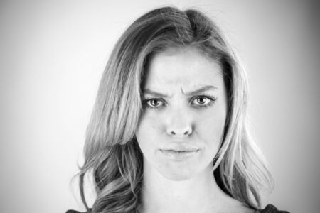 attractive woman on plein background shot in studio with soft lights with an interesting expression and dramatic lighting Black And White, b&wの写真素材
