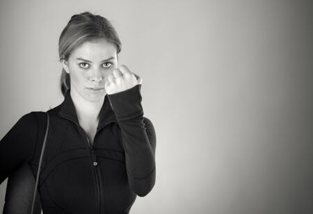 attractive woman on plein background shot in studio with soft lights with an interesting expression and dramatic lighting Black And White, b&wの写真素材