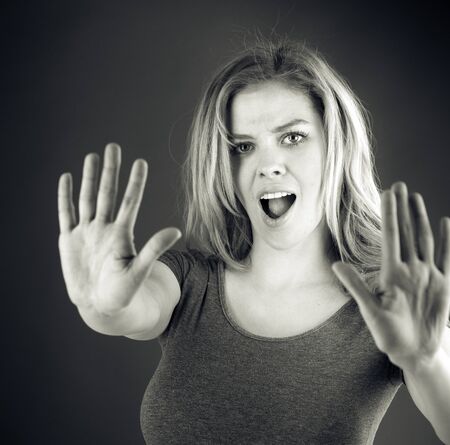 attractive woman on plein background shot in studio with soft lights with an interesting expression and dramatic lighting Black And White, b&wの写真素材