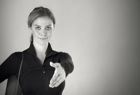 attractive woman on plein background shot in studio with soft lights with an interesting expression and dramatic lighting Black And White, b&wの写真素材