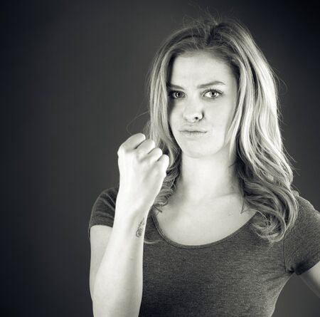attractive woman on plein background shot in studio with soft lights with an interesting expression and dramatic lighting Black And White, b&wの写真素材