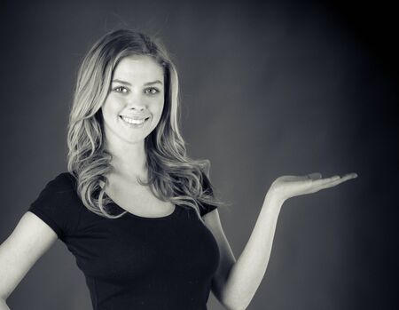attractive woman on plein background shot in studio with soft lights with an interesting expression and dramatic lighting Black And White, b&wの写真素材