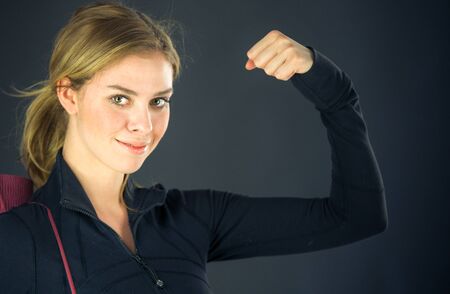 attractive woman on plein background shot in studio with soft lights with an interesting expression and dramatic lightingの写真素材