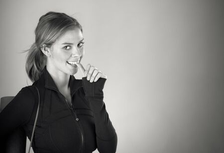 attractive woman on plein background shot in studio with soft lights with an interesting expression and dramatic lighting Black And White, b&wの写真素材
