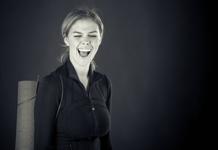attractive woman on plein background shot in studio with soft lights with an interesting expression and dramatic lighting Black And White, b&wの写真素材