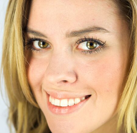 attractive woman on plein background shot in studio with soft lights with an interesting expression and dramatic lightingの写真素材
