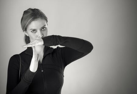attractive woman on plein background shot in studio with soft lights with an interesting expression and dramatic lighting Black And White, b&wの写真素材