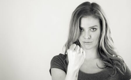 attractive woman on plein background shot in studio with soft lights with an interesting expression and dramatic lighting Black And White, b&wの写真素材