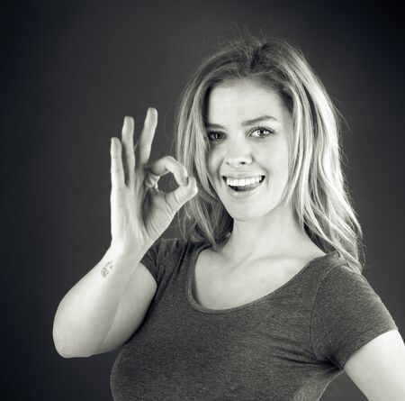 attractive woman on plein background shot in studio with soft lights with an interesting expression and dramatic lighting Black And White, b&wの写真素材