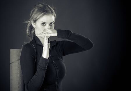 attractive woman on plein background shot in studio with soft lights with an interesting expression and dramatic lighting Black And White, b&wの写真素材