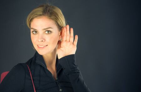 attractive woman on plein background shot in studio with soft lights with an interesting expression and dramatic lightingの写真素材