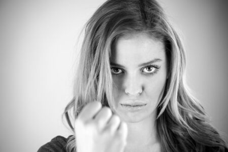 attractive woman on plein background shot in studio with soft lights with an interesting expression and dramatic lighting Black And White, b&wの写真素材