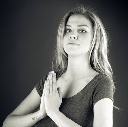 attractive woman on plein background shot in studio with soft lights with an interesting expression and dramatic lighting Black And White, b&wの写真素材