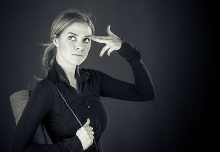 attractive woman on plein background shot in studio with soft lights with an interesting expression and dramatic lighting Black And White, b&wの写真素材
