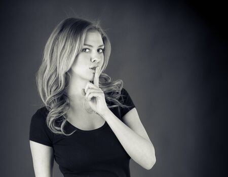 attractive woman on plein background shot in studio with soft lights with an interesting expression and dramatic lighting Black And White, b&wの写真素材
