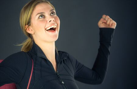 attractive woman on plein background shot in studio with soft lights with an interesting expression and dramatic lightingの写真素材