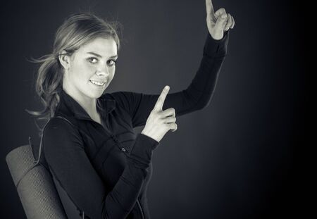 attractive woman on plein background shot in studio with soft lights with an interesting expression and dramatic lighting Black And White, b&wの写真素材