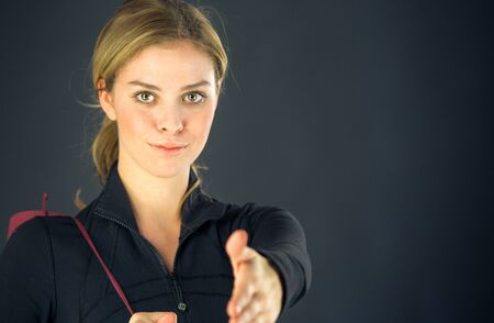 attractive woman on plein background shot in studio with soft lights with an interesting expression and dramatic lightingの写真素材