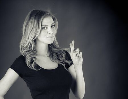 attractive woman on plein background shot in studio with soft lights with an interesting expression and dramatic lighting Black And White, b&wの写真素材