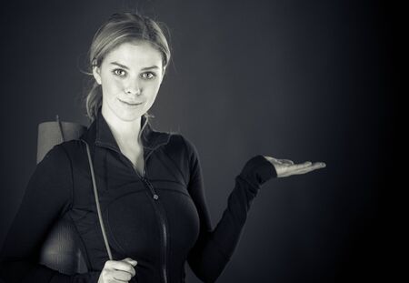 attractive woman on plein background shot in studio with soft lights with an interesting expression and dramatic lighting Black And White, b&wの写真素材