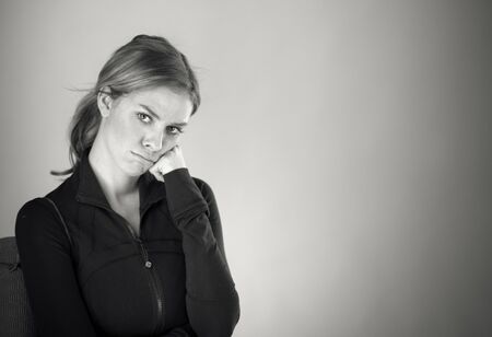attractive woman on plein background shot in studio with soft lights with an interesting expression and dramatic lighting Black And White, b&wの写真素材