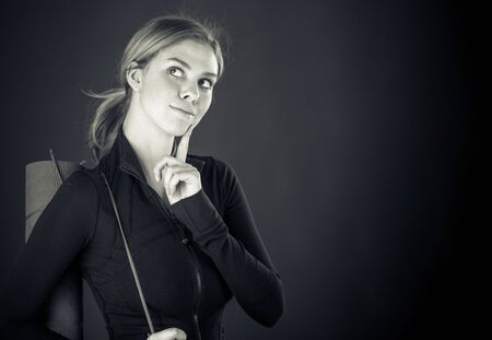 attractive woman on plein background shot in studio with soft lights with an interesting expression and dramatic lighting Black And White, b&wの写真素材