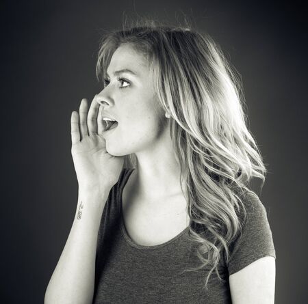 attractive woman on plein background shot in studio with soft lights with an interesting expression and dramatic lighting Black And White, b&wの写真素材