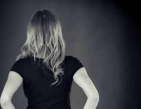 attractive woman on plein background shot in studio with soft lights with an interesting expression and dramatic lighting Black And White, b&wの写真素材
