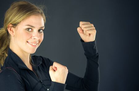 attractive woman on plein background shot in studio with soft lights with an interesting expression and dramatic lightingの写真素材