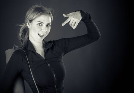 attractive woman on plein background shot in studio with soft lights with an interesting expression and dramatic lighting Black And White, b&wの写真素材